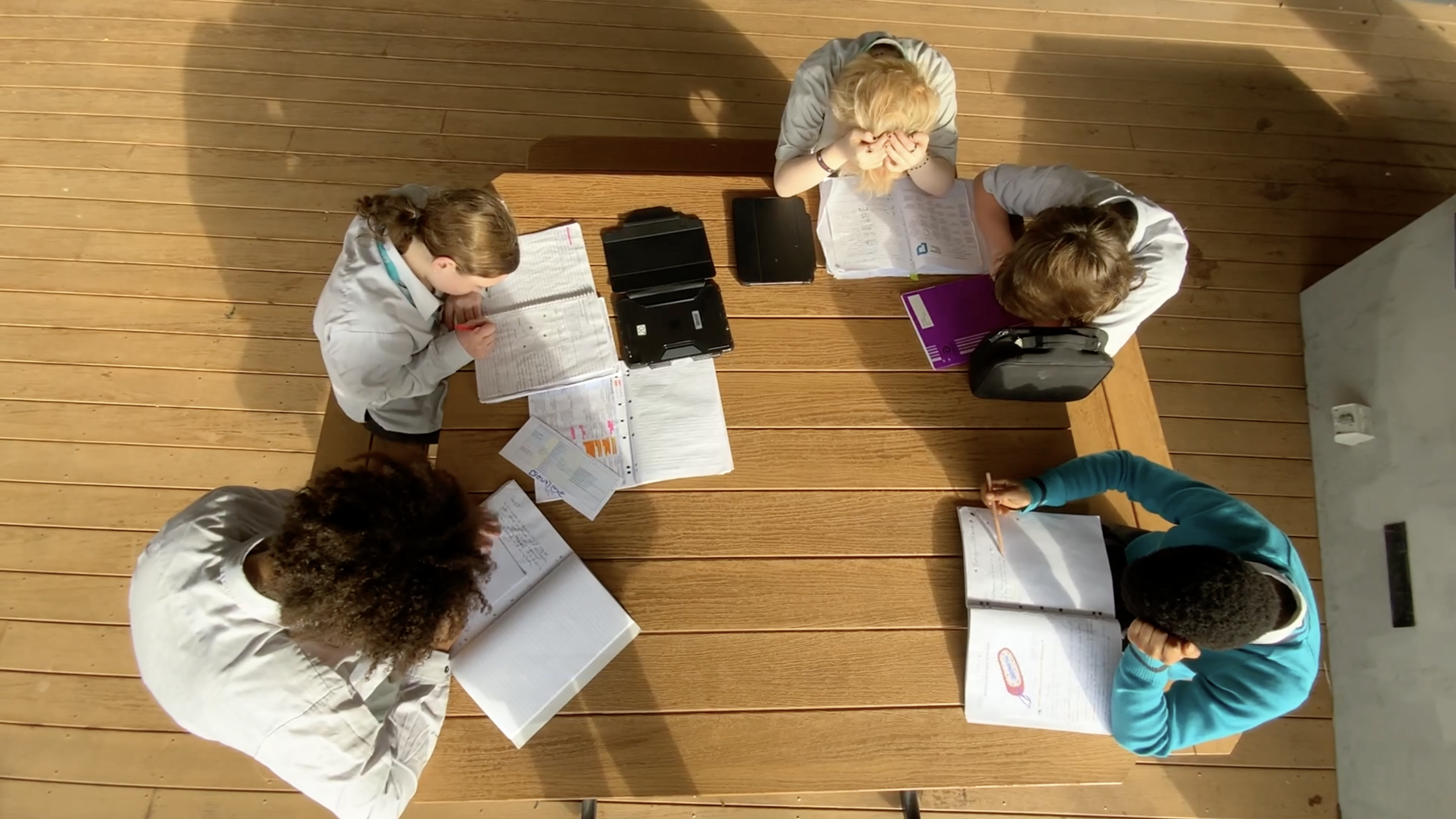 students working on homework individually but together