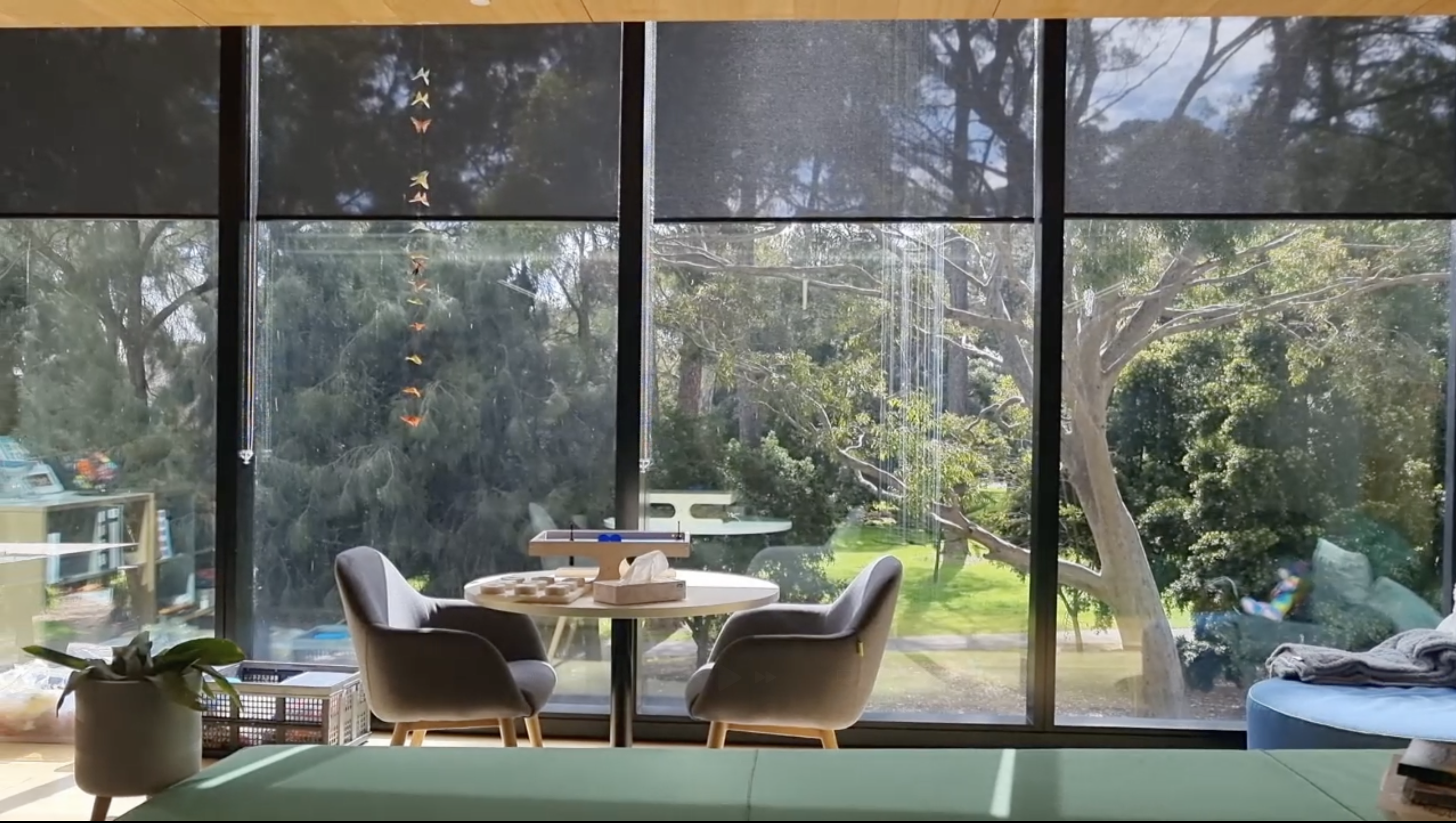 students photgraphed through a glass wall